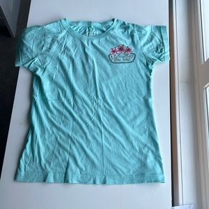 This teal shirt from Ron Jon surf shop is a size women’s small.